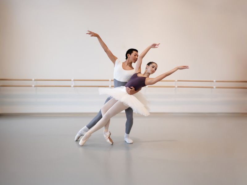 Dancers Pose with Extended Arms