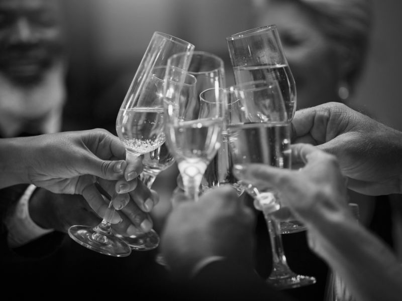 Group of hands with champagne Orlando ballet ball